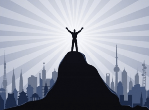 standing at the top of the mountain